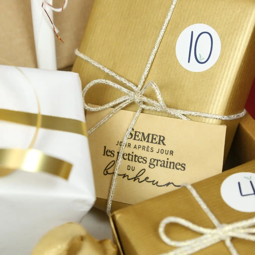 Paquets numérotés dorés, carte « Semer les petites graines du bonheur »